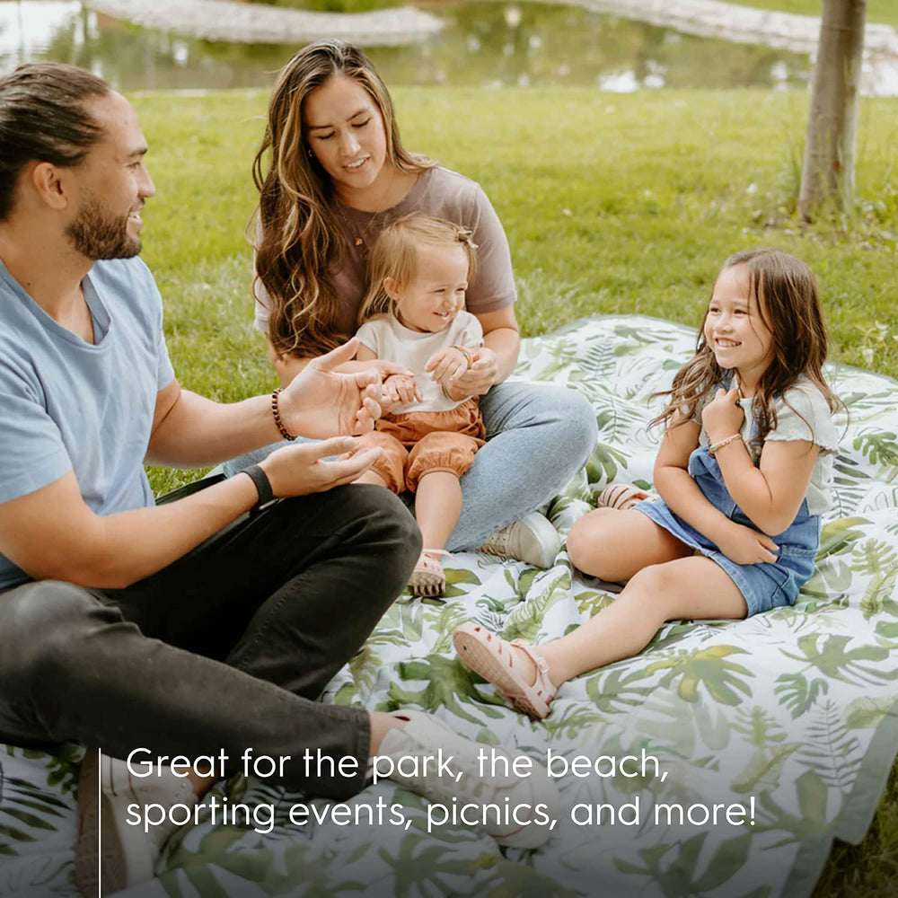 Little Unicorn family enjoying picnic on blanket demonstrating comfort and space