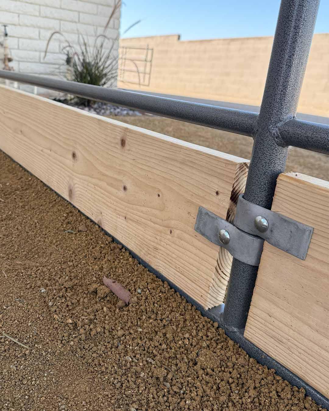 Livestock Corrals clamp being installed with hand tools showing quick setup benefit