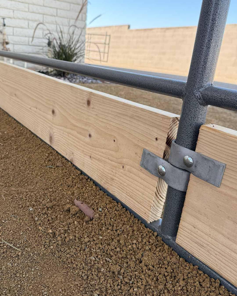 Livestock Corrals clamp being installed with hand tools showing quick setup benefit