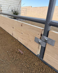Livestock Corrals clamp being installed with hand tools showing quick setup benefit