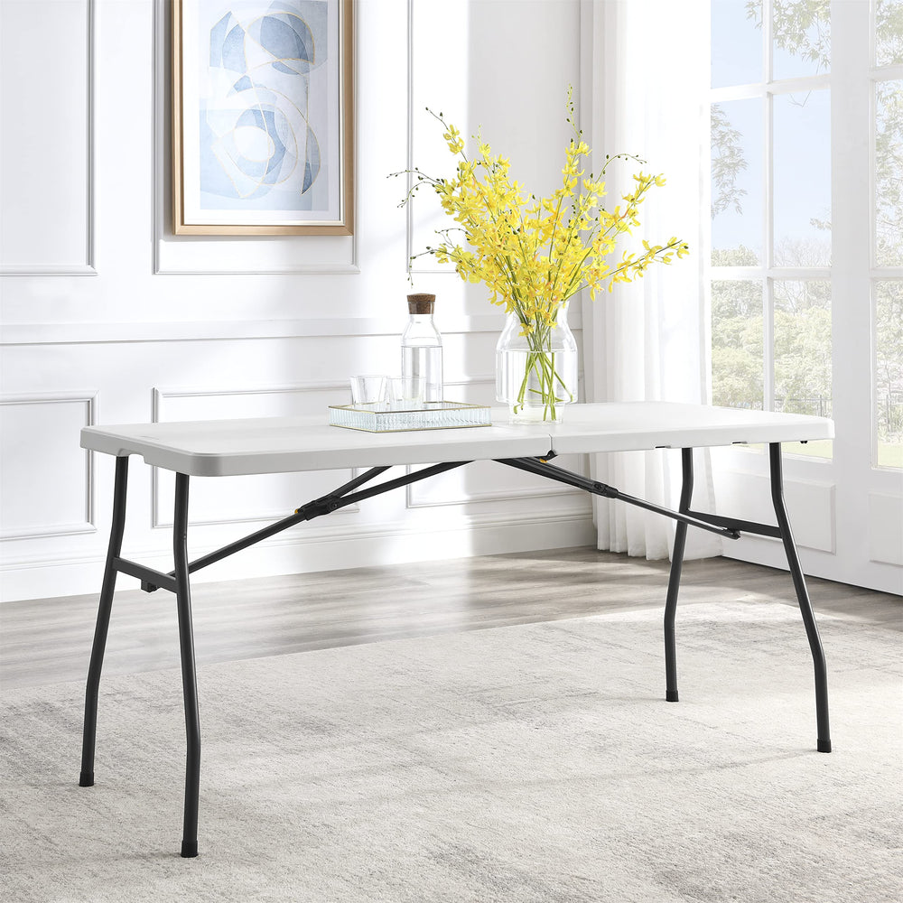 Living and More table beside chairs showing scale and seating capacity benefit