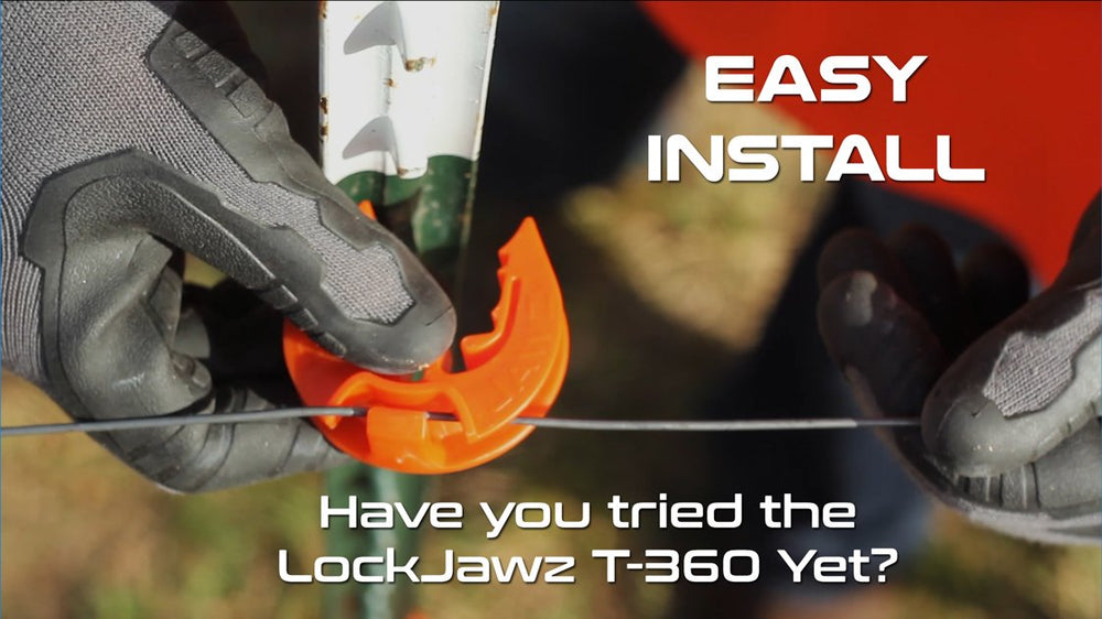 Lock Jawz insulators installed along pasture t-posts demonstrating durable field performance