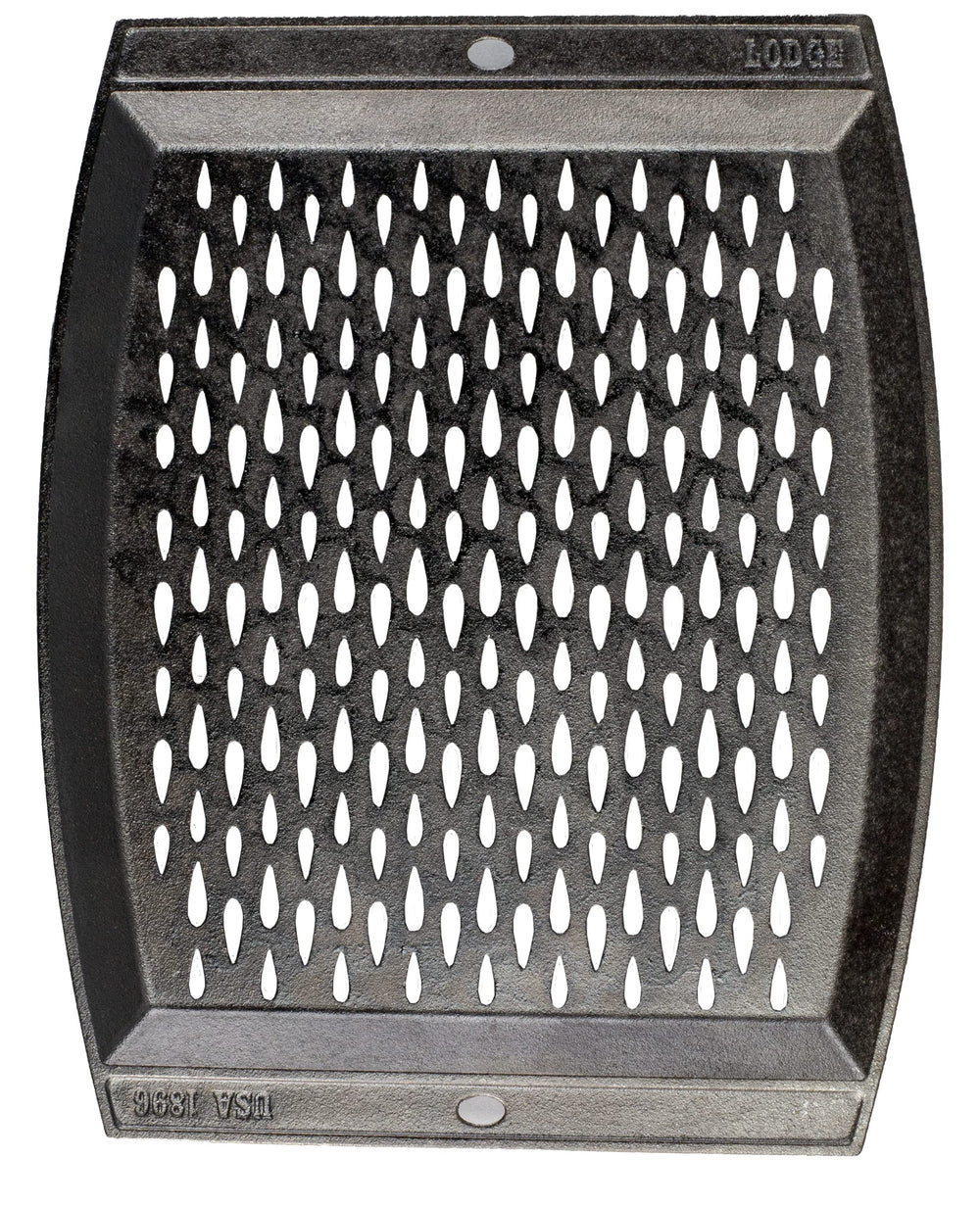 Lodge close-up of teardrop perforations letting smoke in and preventing food from falling