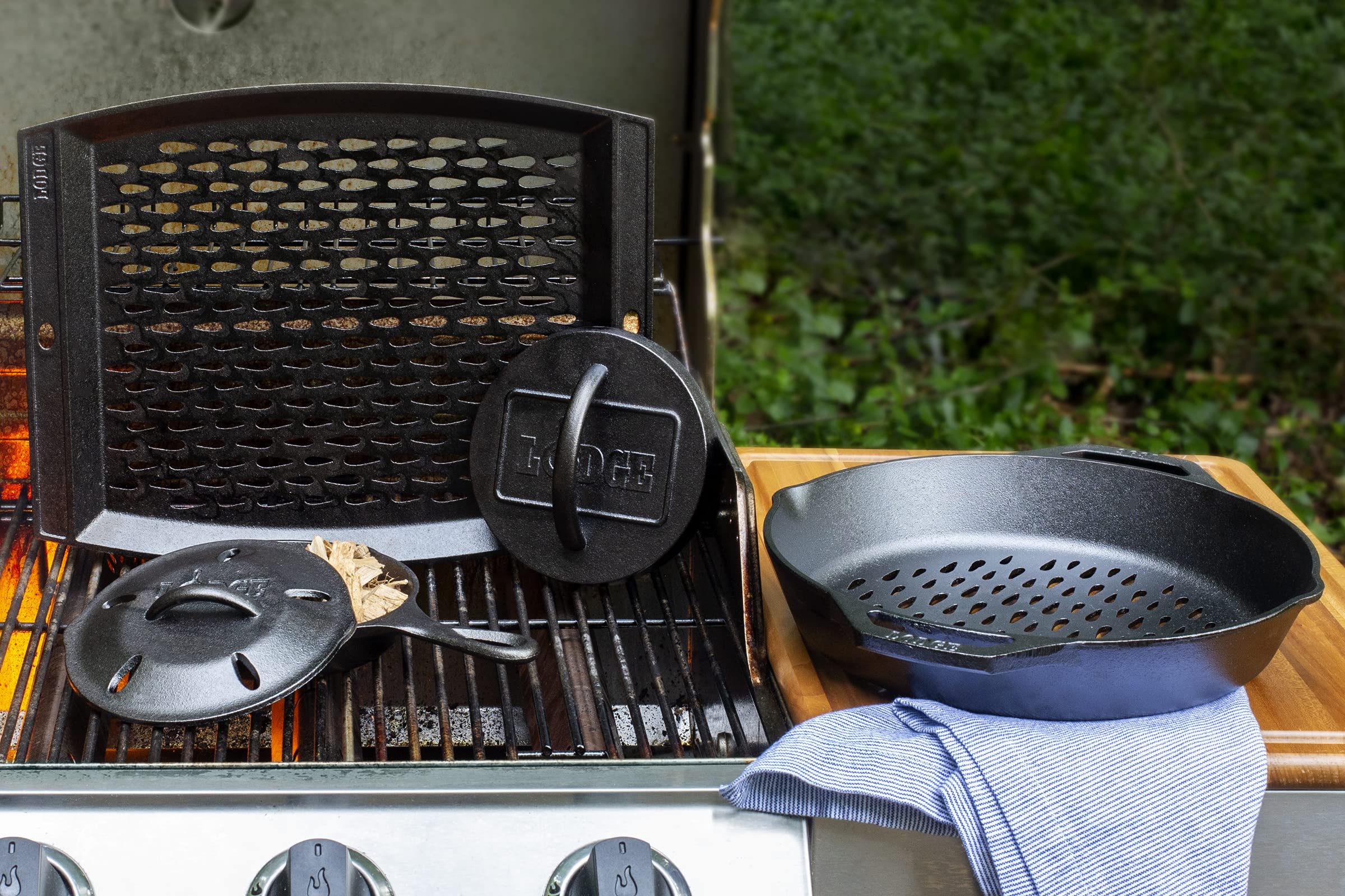Lodge grill topper next to spatula showing scale and generous 15 by 12-inch cooking area