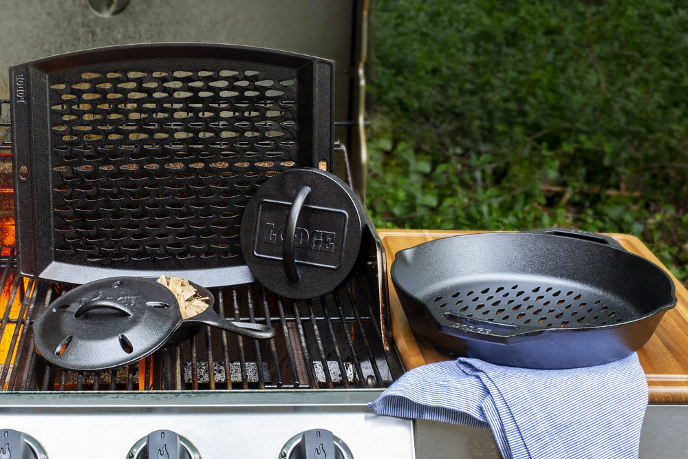 Lodge grill topper next to spatula showing scale and generous 15 by 12-inch cooking area