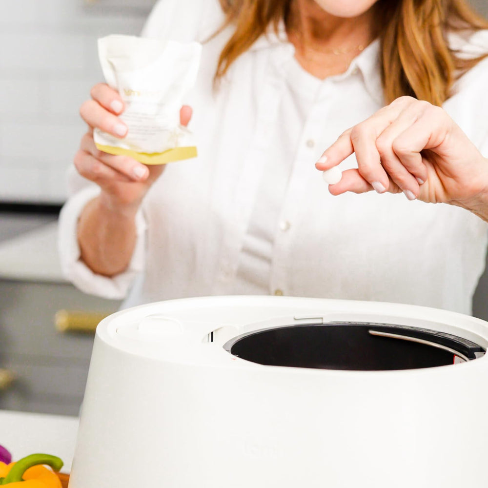 Lomi kit next to hand for scale, brand offers easy predictable refills