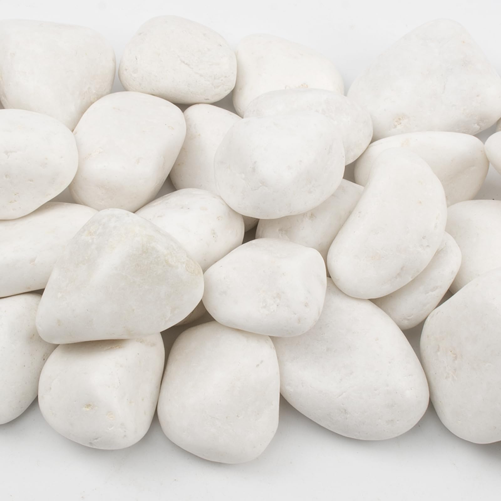 LOOIOOJ walkway edged with white river rocks creating low-maintenance landscaping