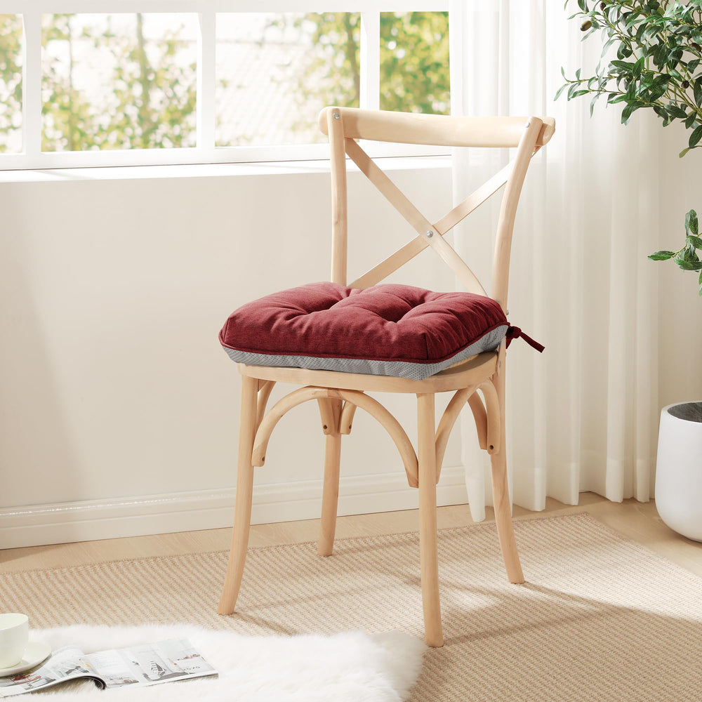 Love's cabin burgundy cushions styled in a dining room for cozy seating