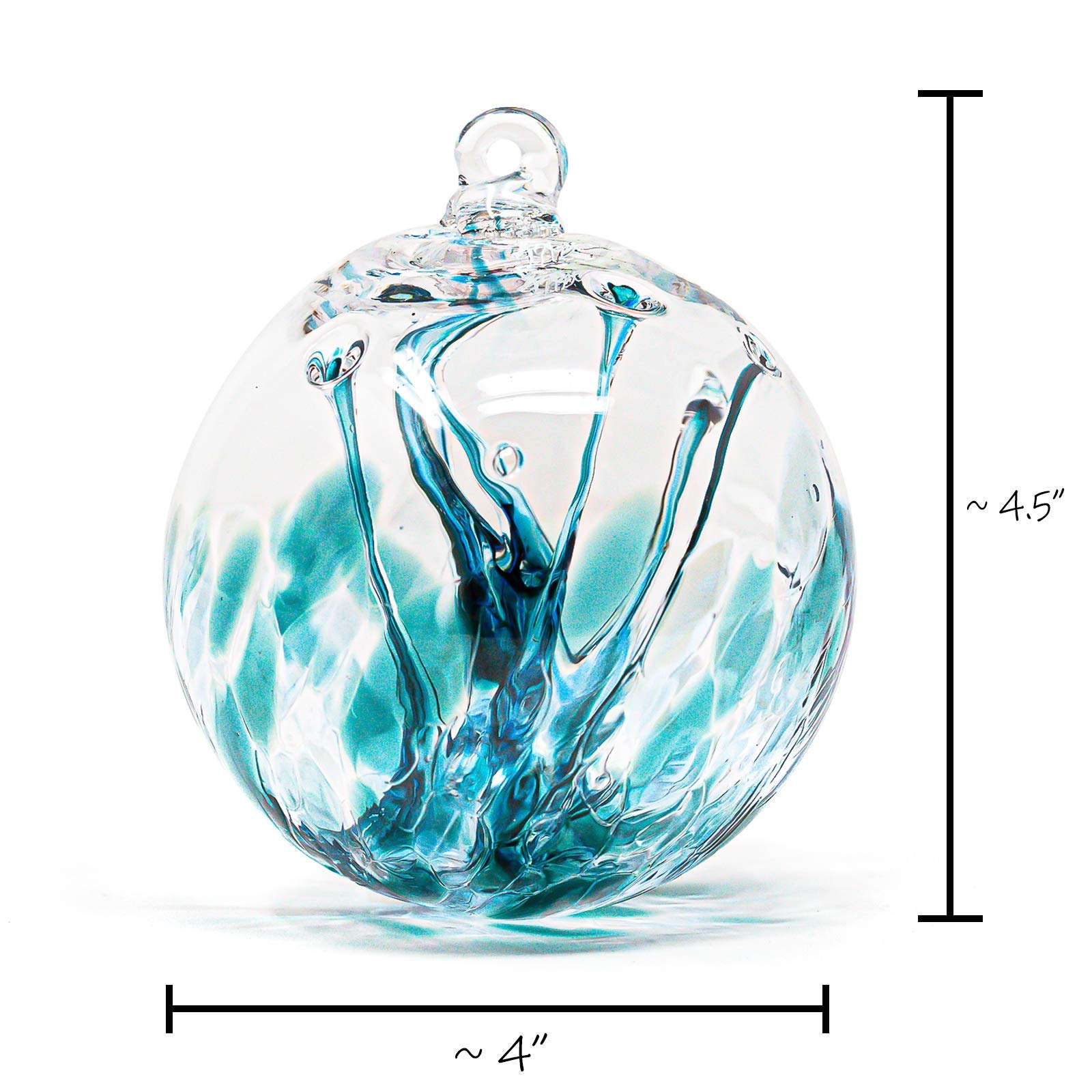 Luke Adams gazing ball in garden with plants, adding color and focal interest