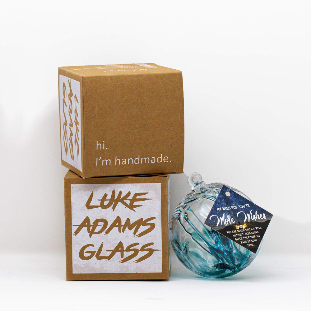Luke Adams gazing ball next to a ruler showing 12 inch scale and size clarity