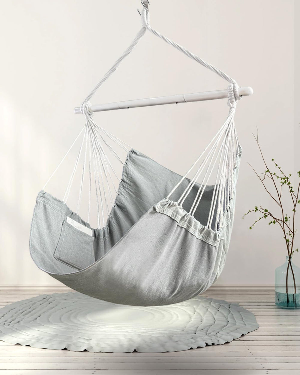 Lulladle hammock chair hung in a bedroom for cozy reading nook and space-saving benefit