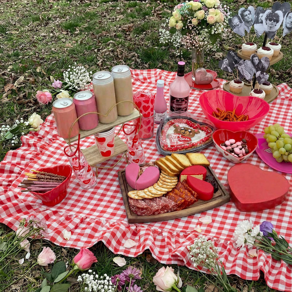 Lumina Garden spread beside people to show generous 71x90 inch coverage