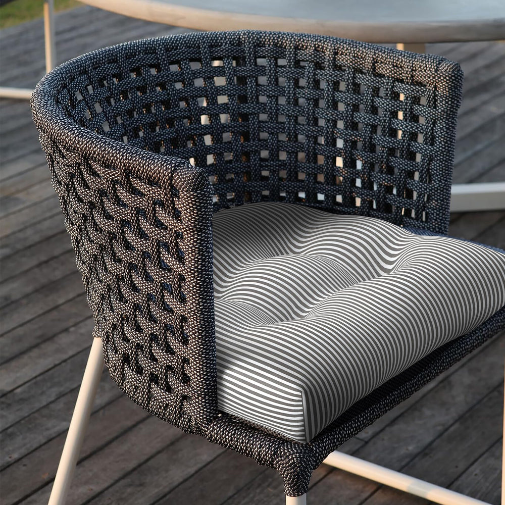 LVTXIII lifestyle patio dining setup showing coordinated cushions enhancing outdoor gatherings