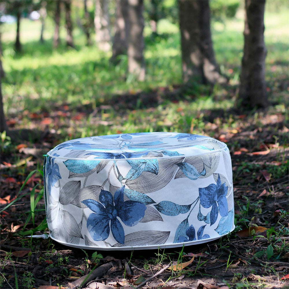 LVTXIII Clemens Noir Blue pouf on a patio creating stylish outdoor seating option