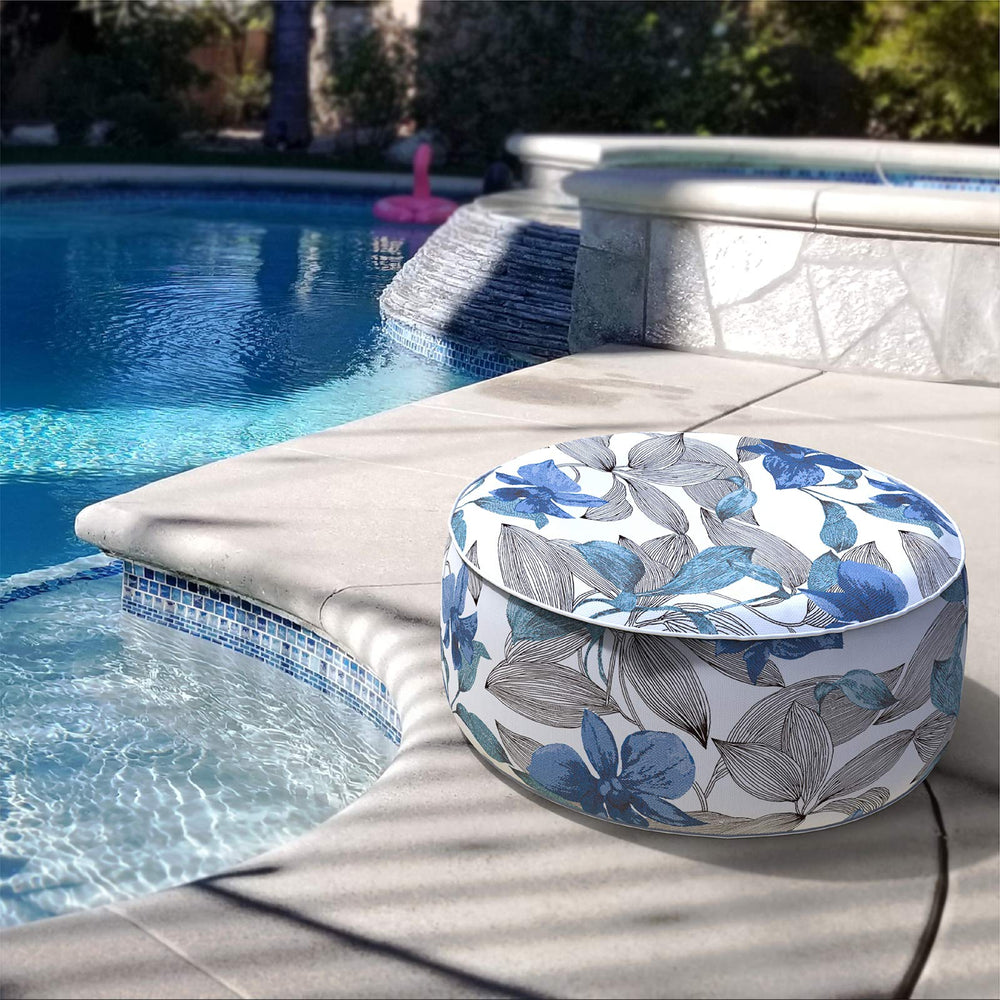 LVTXIII pouf next to a seated person showing size and scale for everyday use