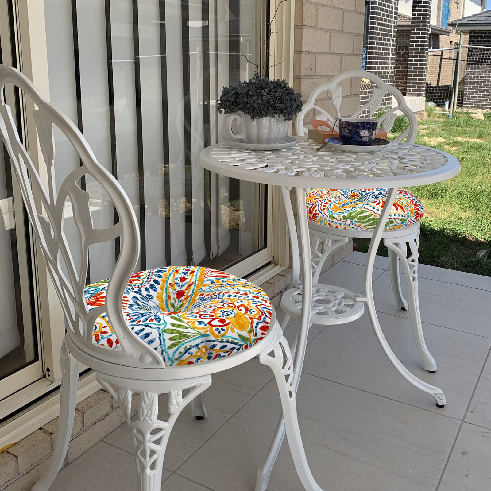 LVTXIII cushions styled on balcony breakfast table, creates inviting outdoor space