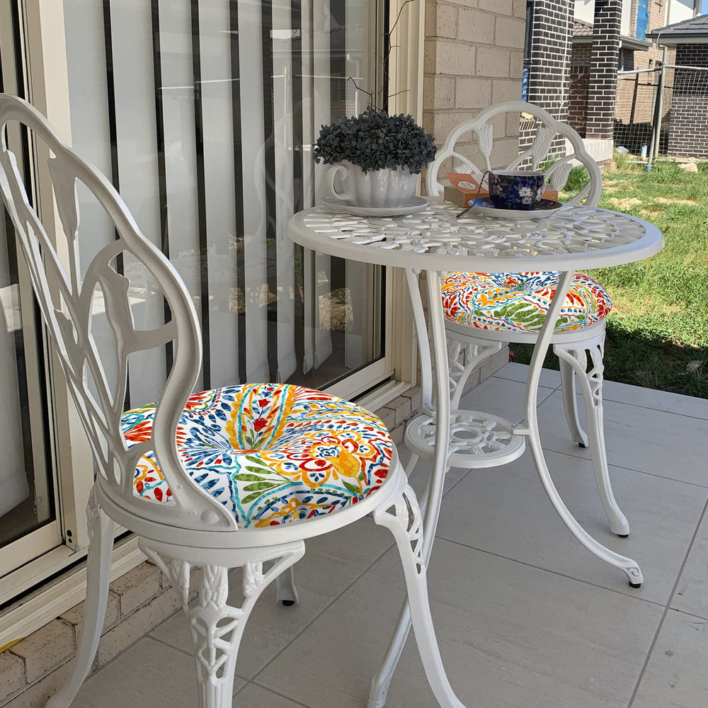 LVTXIII cushions styled on balcony breakfast table, creates inviting outdoor space