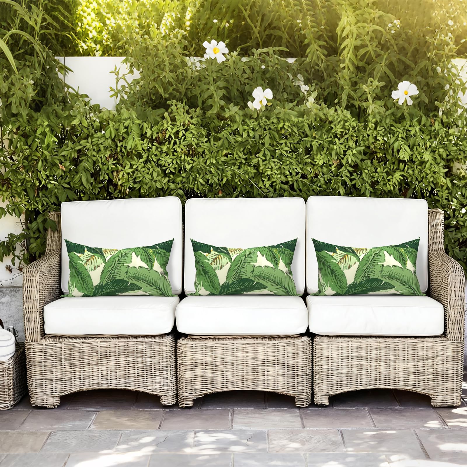 LVTXIII pillows styled on patio sofa demonstrating outdoor décor upgrade