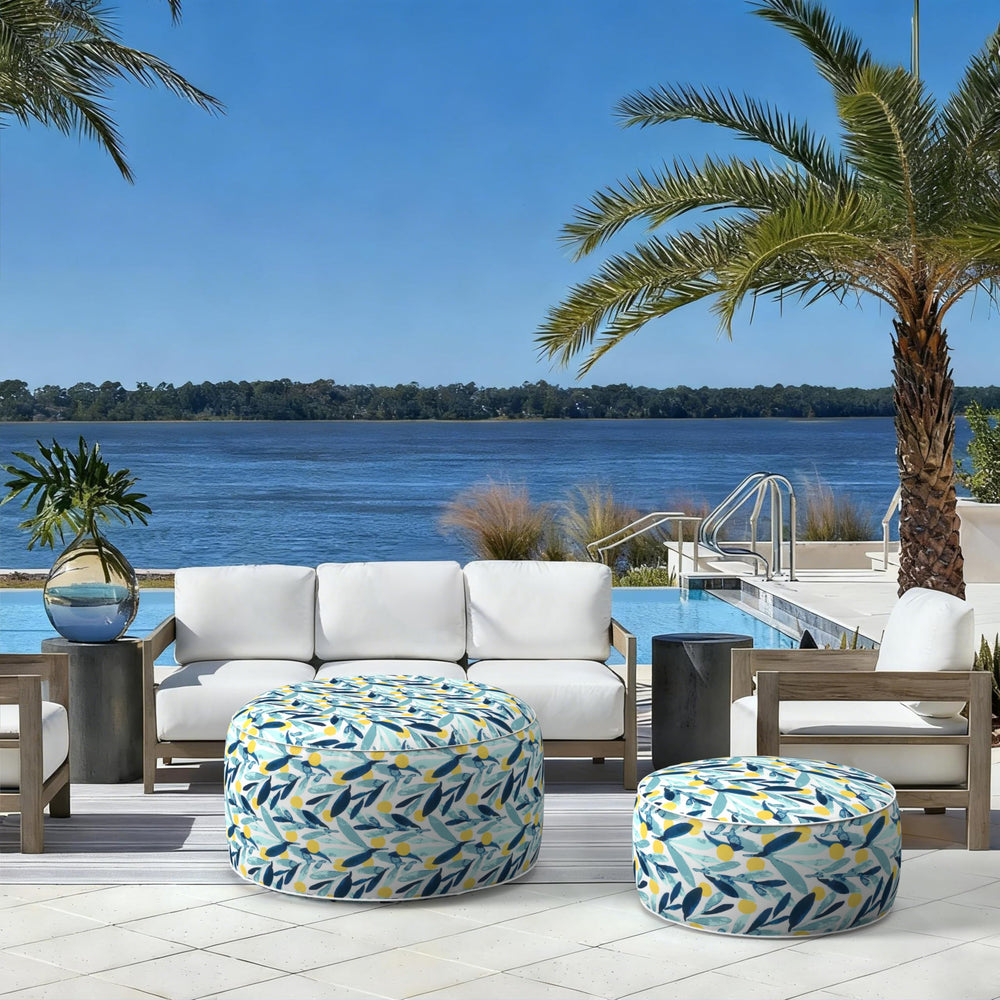 LVTXIII pouf in garden setting providing decorative color and outdoor seating convenience