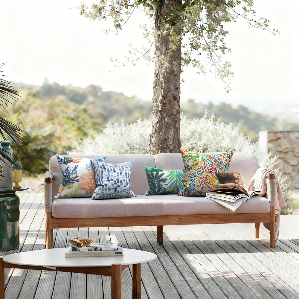 LVTXIII pillow beside chair showing 20x20 size scale for furniture compatibility