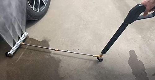 M MINGLE cleaner in use beneath a truck removing road grime efficiently