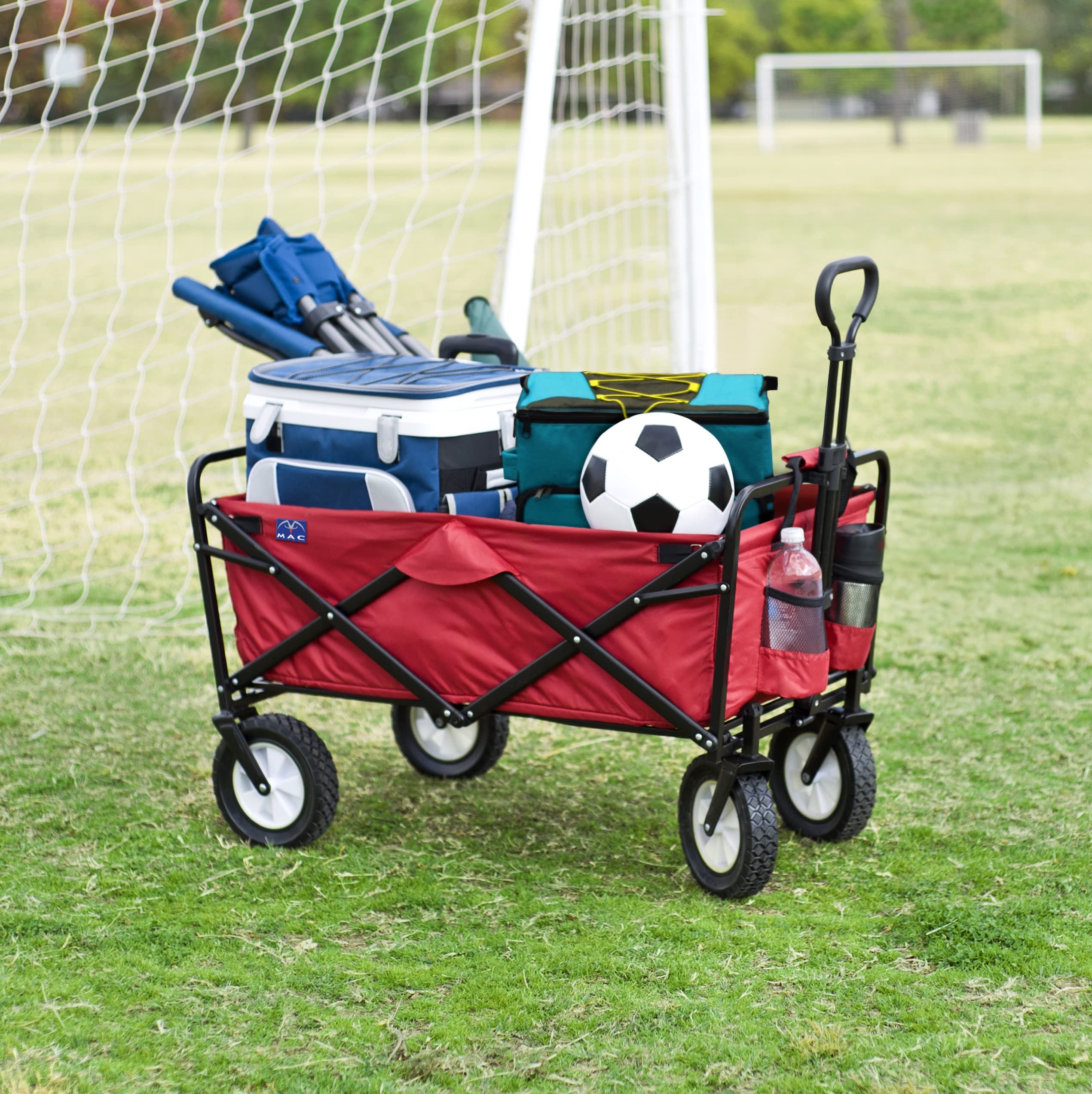 MacSports wagon loaded at a park demonstrating easy transport of coolers and gear