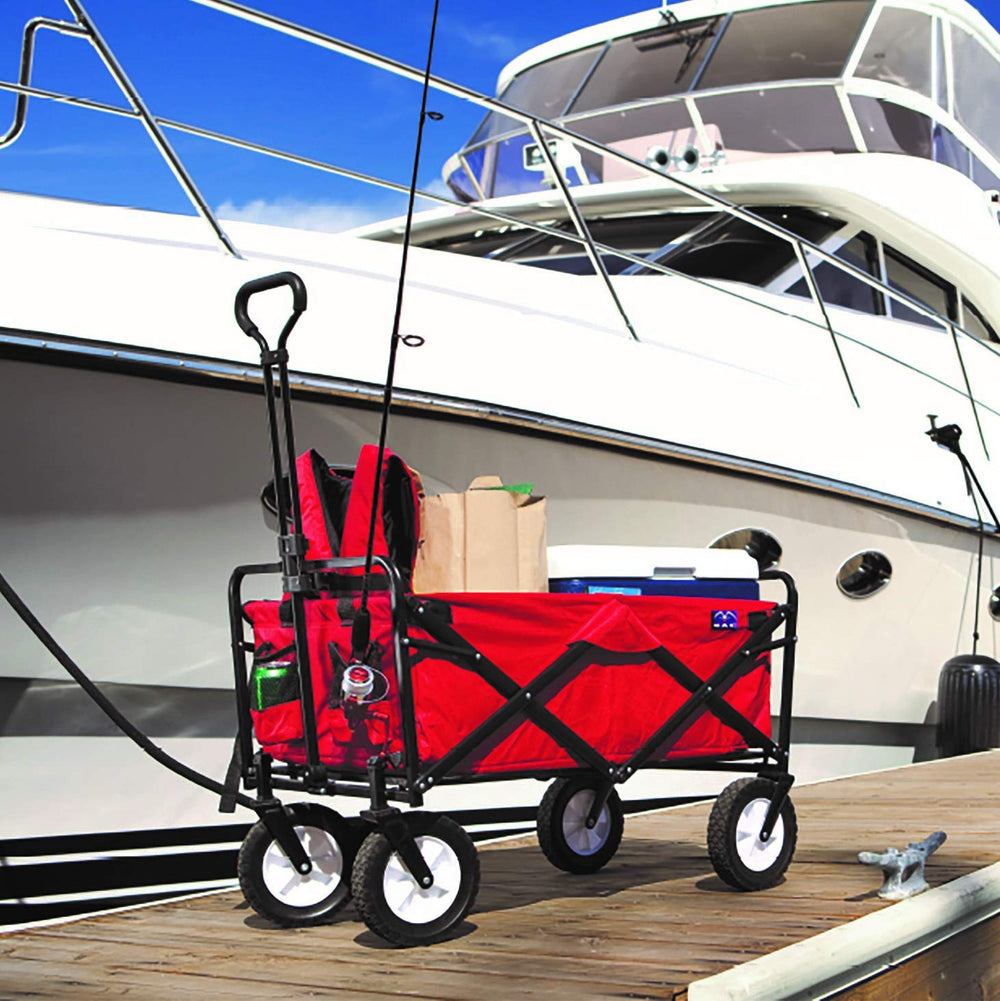 MacSports wagon beside camping gear illustrating interior space and 150 lb capacity
