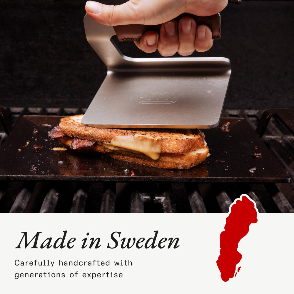 Made In grill press size comparison with hand to show compact portability benefit