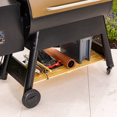 Magna Outdoors shelf loaded with pellets and tools for quick grilling access