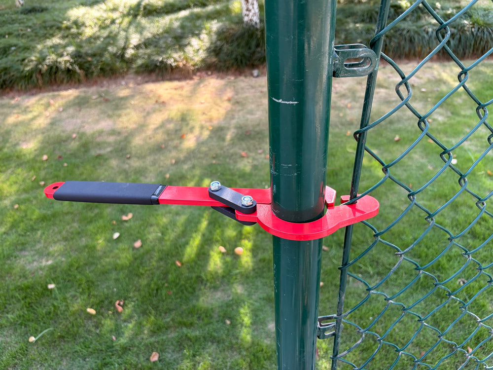 Magoleo on jobsite holding tensioned fabric to keep fence lines straight