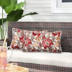 Magpie Fabrics front view of two botanical red orange lumbar pillows showing vibrant pattern and balance