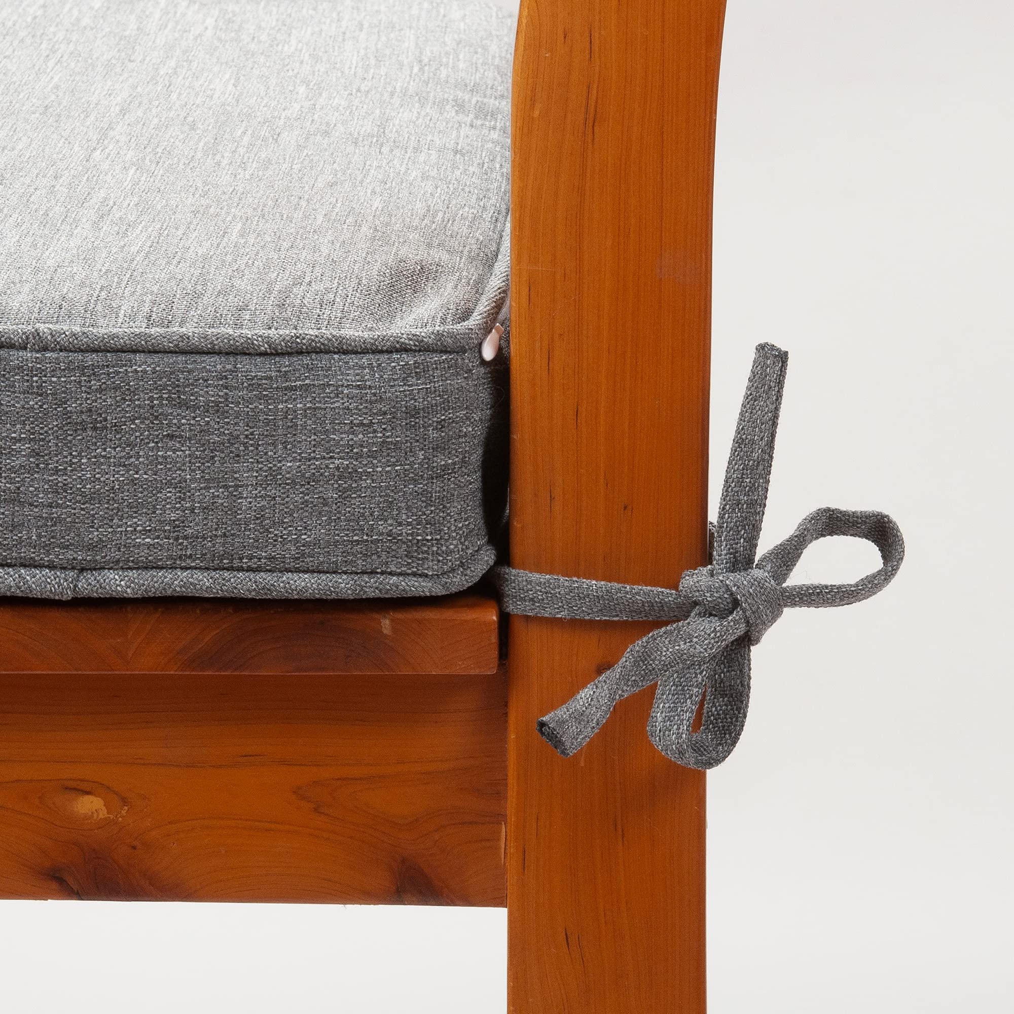 Magpie Fabrics cushions placed on a patio dining set showing weather-ready seating and style