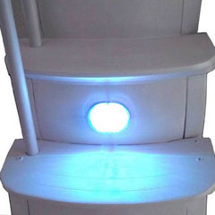 Main Access Smart Lite hanging behind a return jet creating diffused pool lighting