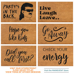 MAINEVENT mat placed at a front door demonstrating practical use and welcoming tone