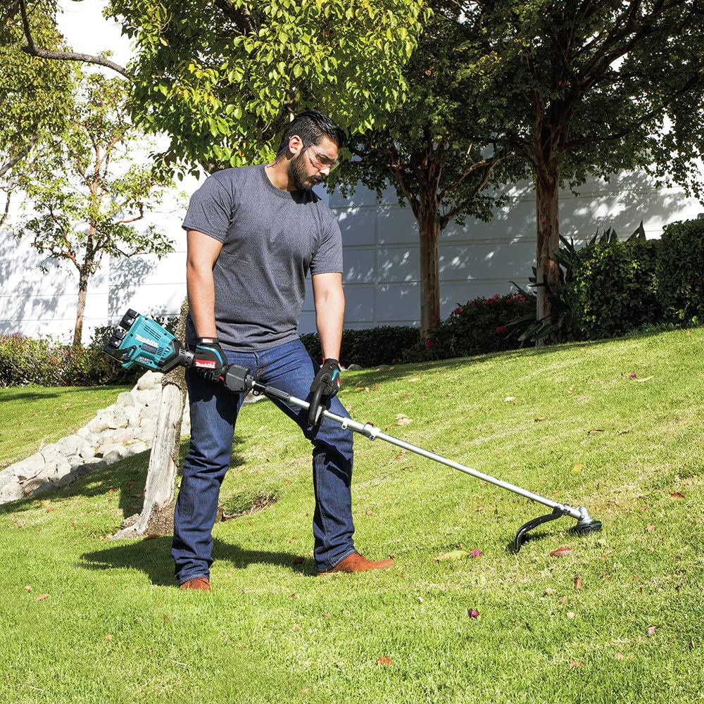 Makita power head in use by landscaper reducing noise and emissions