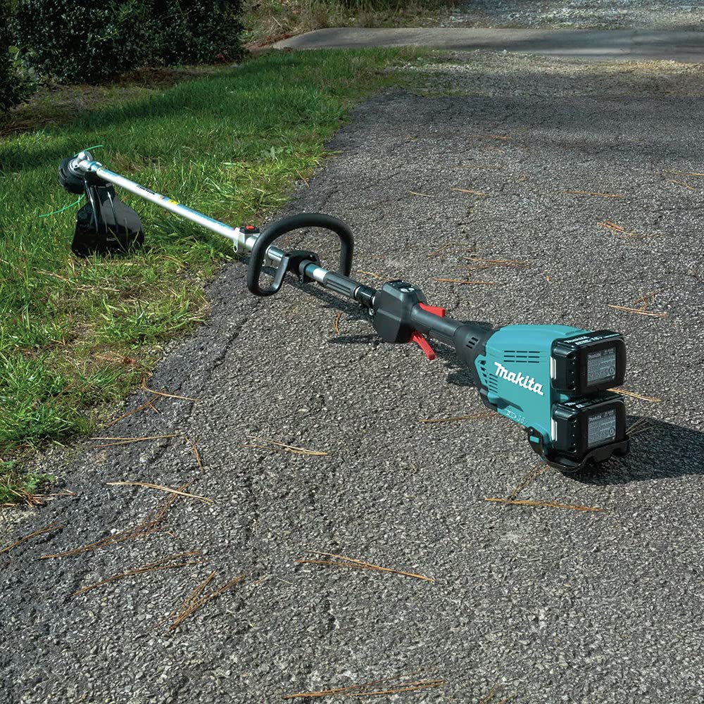 Makita power head beside two 5.0Ah batteries illustrating extended runtime