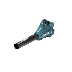 Makita XBU02Z in yard use clearing leaves demonstrating quiet operation and cordless convenience