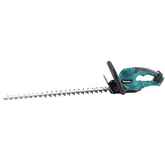 Makita XHU10Z in use trimming a hedge for quieter, emission-free work