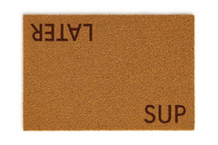 Malibu General Elements front view of Sup Later mat shows bold greeting and quick-clean benefit