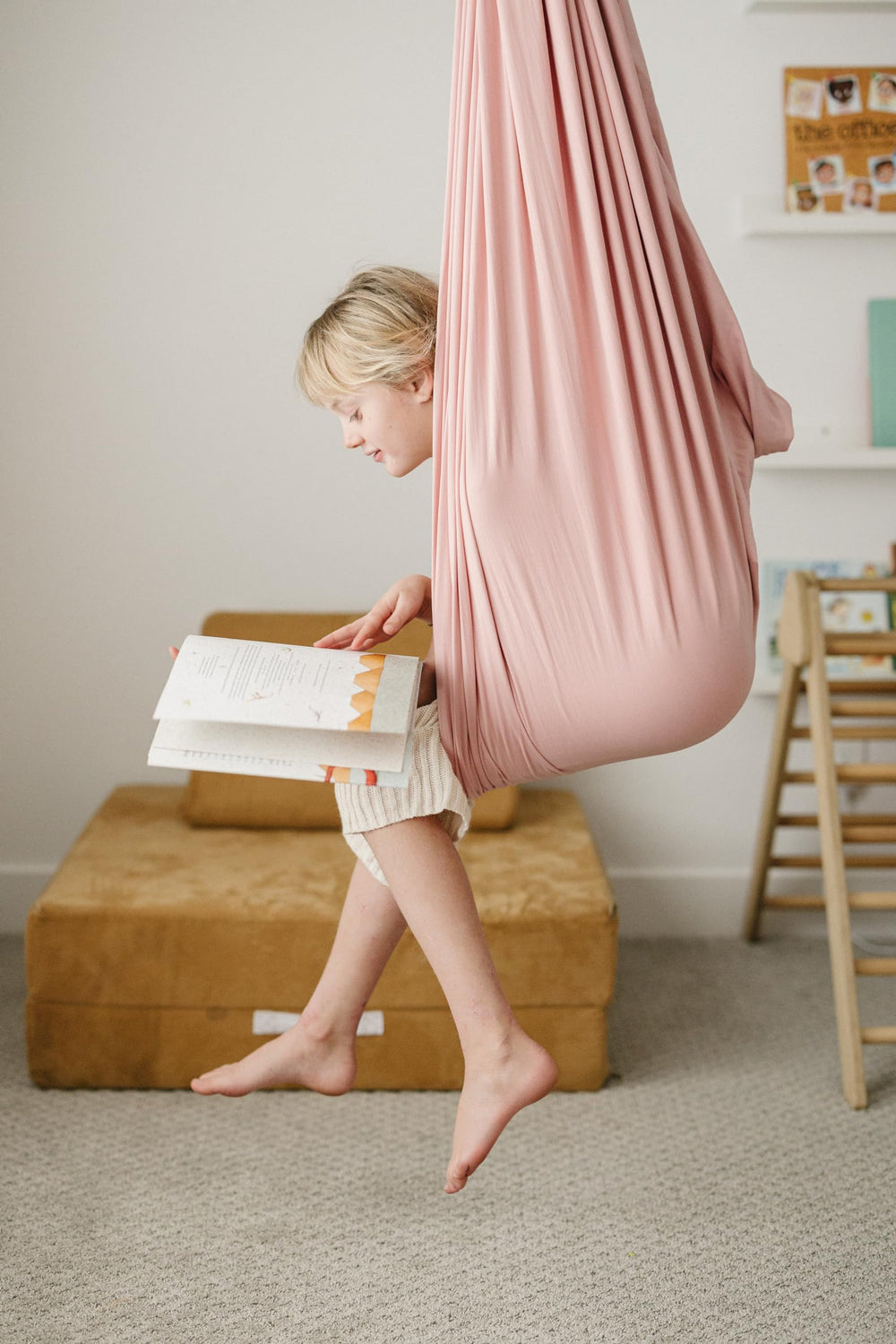 Marlowe & Co swing next to a child for scale showing roomy dimensions and versatile use
