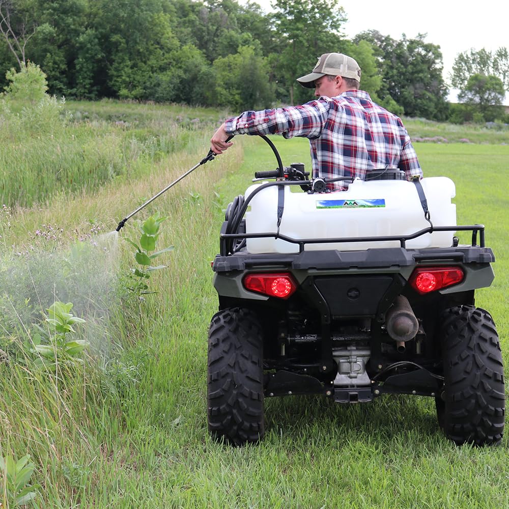 Master Mfg sprayer next to four-wheeler for scale, compact footprint and balanced weight
