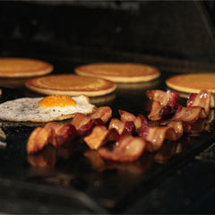 Masterbuilt griddle installed inside Gravity Series 1050 for versatile cooking