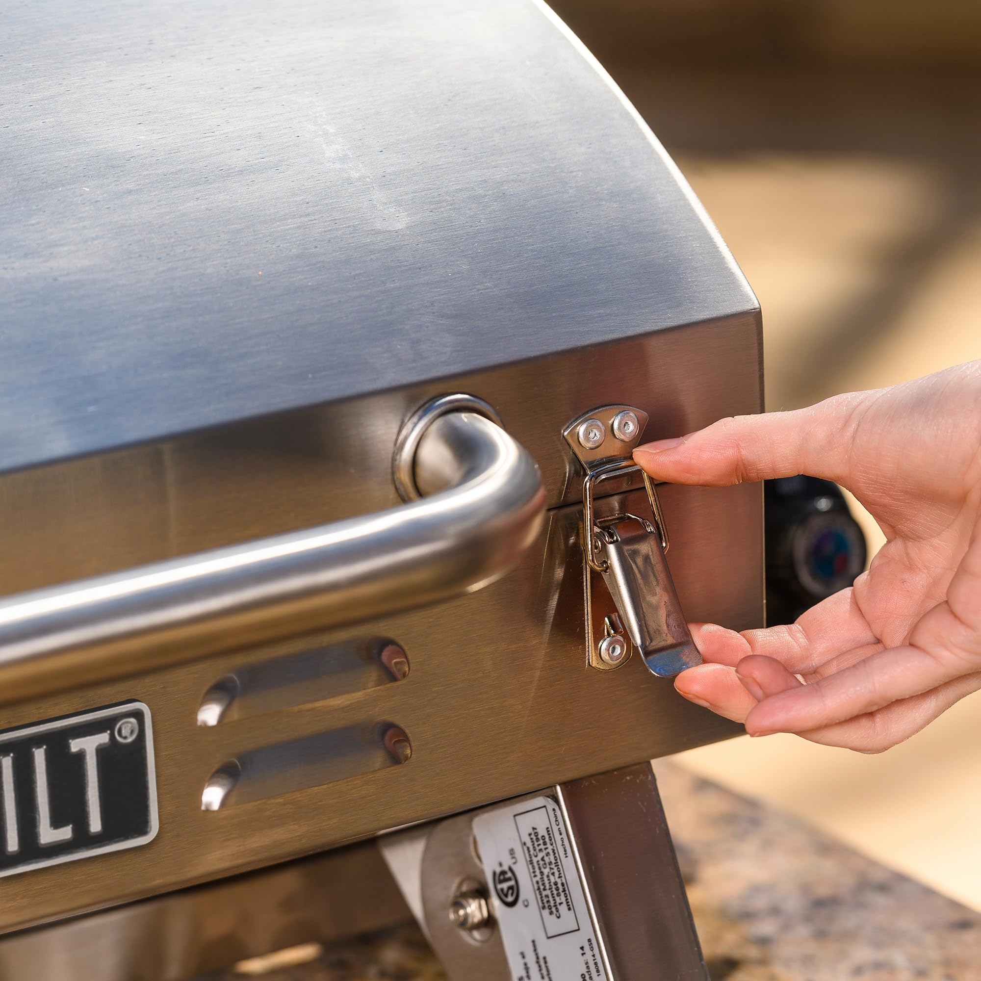 Masterbuilt portable grill set up at a campsite showing quick outdoor cooking convenience