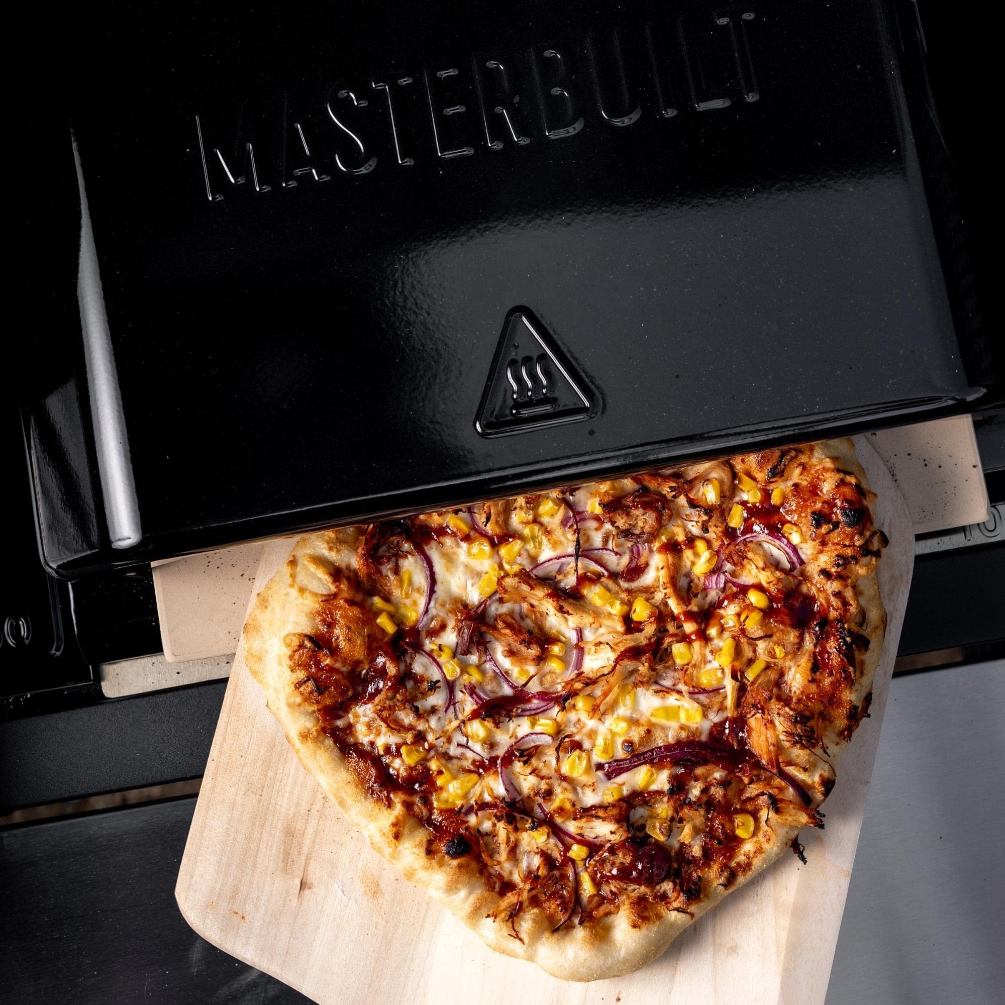 Masterbuilt pizza oven installed in Gravity Series grill demonstrating simple fit