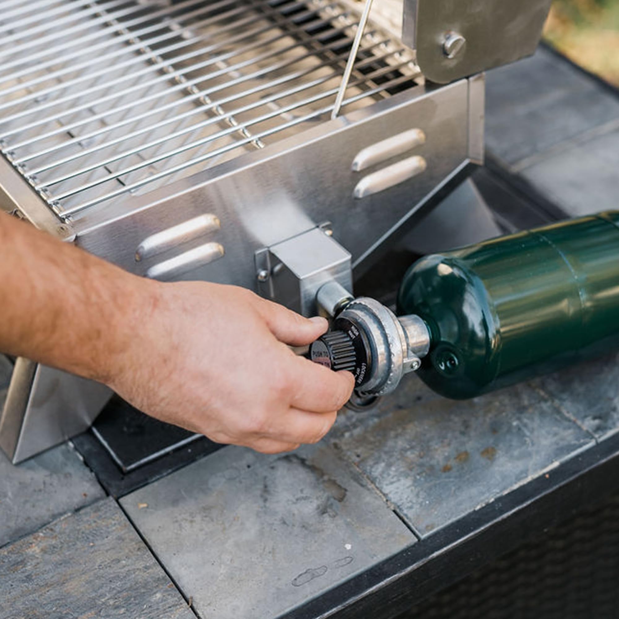 Masterbuilt propane connection and U-shaped burner close-up for consistent heat