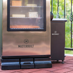 Masterbuilt slow smoker with removable ash tray pulled out for easy cleanup benefit