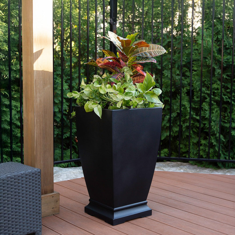 Mayne planter on patio with cascading flowers showing stylish outdoor display