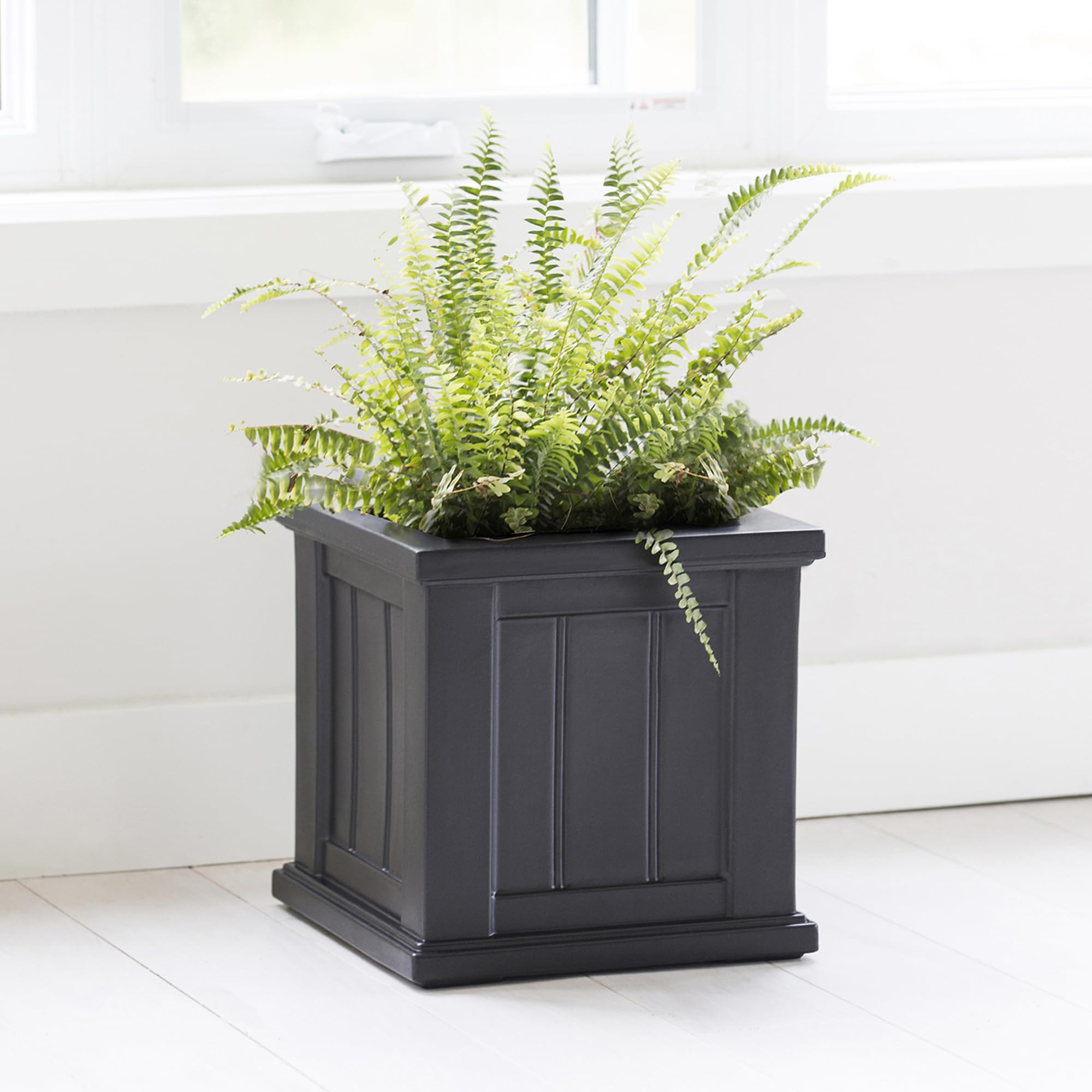 Mayne planter in patio setting demonstrating durable outdoor styling benefit