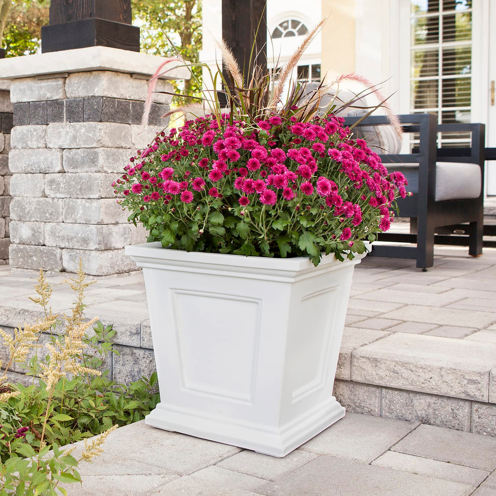 Mayne Fairfield held to scale with hands showing 16-inch size and easy portability benefit