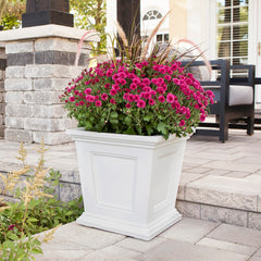 Mayne Fairfield held to scale with hands showing 16-inch size and easy portability benefit